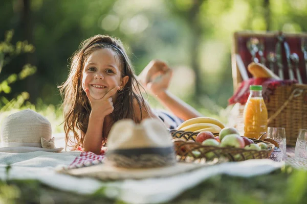 Cute Smiling Little Girl Lying Blanket Grass Enjoying Picnic Day — Stock Photo, Image