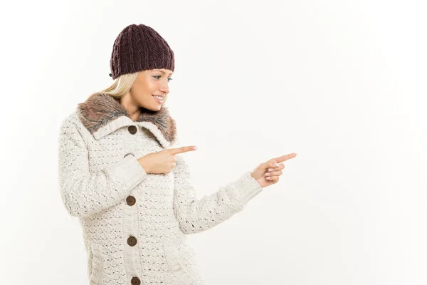 Cute Blonde In Winter Clothes Pointing Away — Stock Photo, Image
