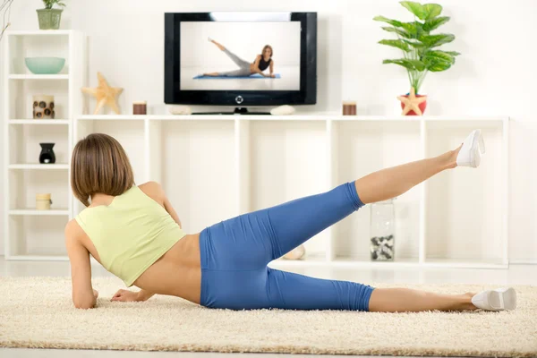 Woman Exercise In Front Of TV — Stock Photo, Image