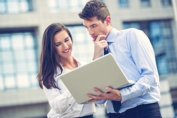Young Business Partners With laptop — Stock Photo, Image