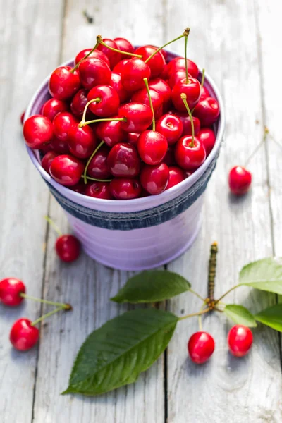 Fruit cherries bucket table — Stock Photo, Image