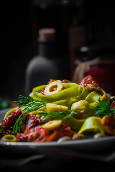 Warm lunch Pasta tomato sauce capers asparagus Magic light — Stock Photo, Image