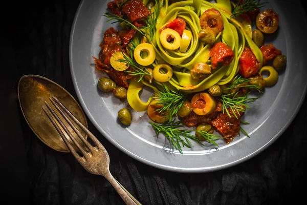 Warm lunch Pasta tomato sauce capers asparagus Magic light — Stock Photo, Image