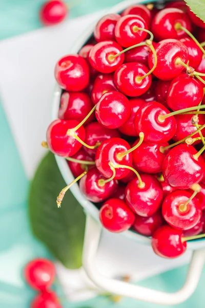 Fresh red cherry fruit green colander — Stock Photo, Image