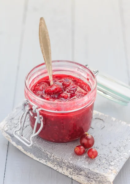 Open jar gooseberry jam spoon middle — Stock Photo, Image