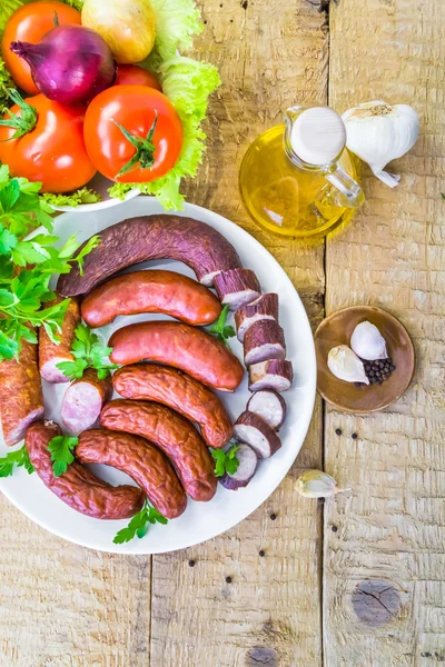 Plate full sausage spices herbs — Stock Photo, Image