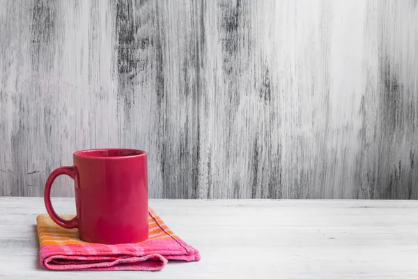 Still life red mug kitchen cloth — Stock Photo, Image