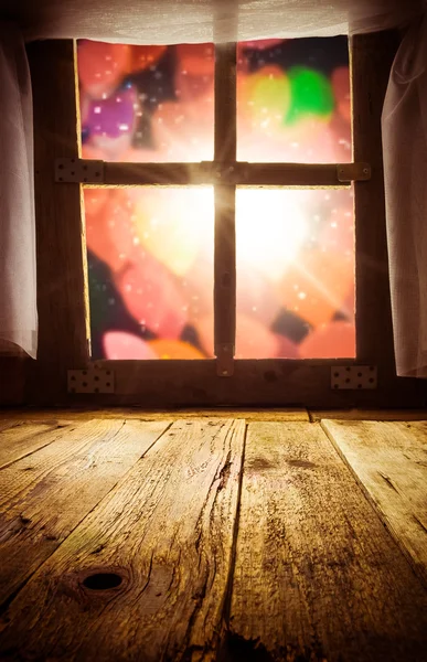 Old rural interior: window table overlooking blurry lights space — Stock Photo, Image