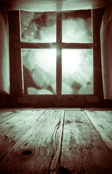 Old rural interior: window table overlooking blurry lights space — Stock Photo, Image