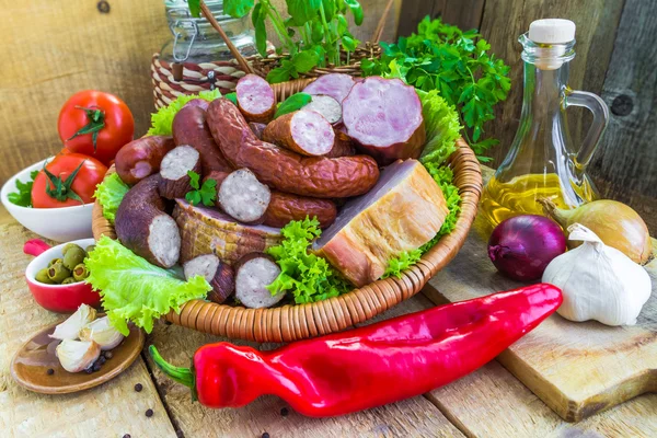 Assortment meats sausage bacon green — Stock Photo, Image
