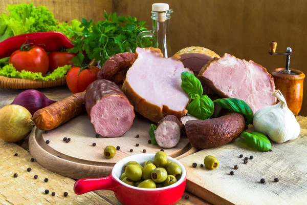 Variety meat products wooden cutting boards — Stock Photo, Image