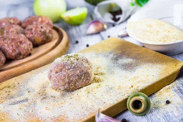 Process rolling raw meatballs breadcrumbs — Stock Photo, Image