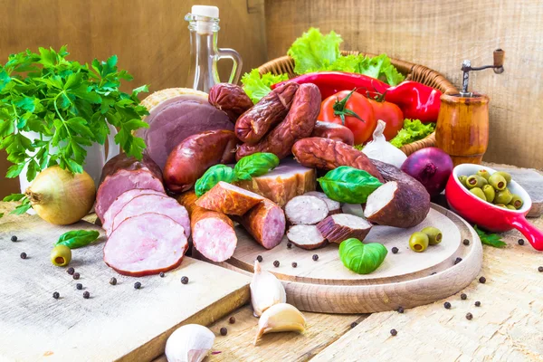 Variety meat products wooden cutting boards — Stock Photo, Image