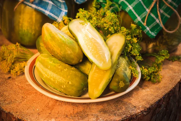 Chopped pickled cucumbers plate wooden board — Stock Photo, Image