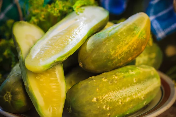 Chopped pickled cucumbers plate wooden board — Stock Photo, Image