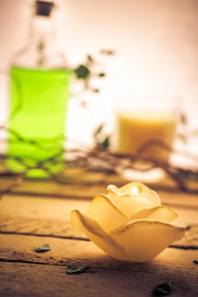 Scented candle sea shells wooden background — Stock Photo, Image