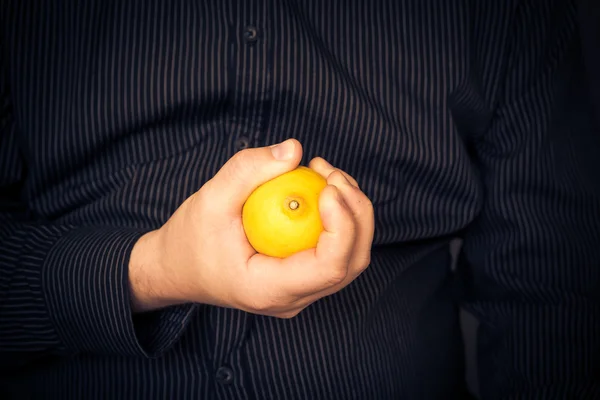 Man yellow lemon hand — Stock Photo, Image