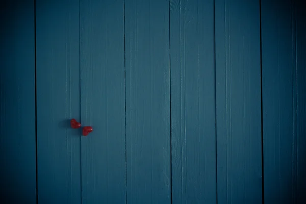 Many colorful little hearts wooden background — Stock Photo, Image