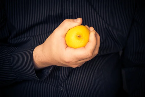 Man yellow lemon hand — Stock Photo, Image