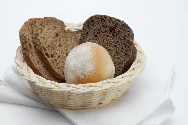 Close up view of some break in small basket on whit back — стоковое фото