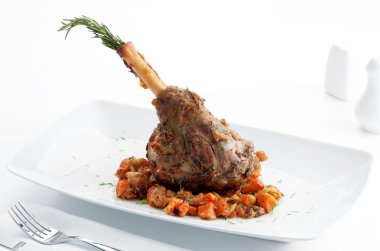 Plate with roast leg of lamb, vegetables and rosemary on white back clipart