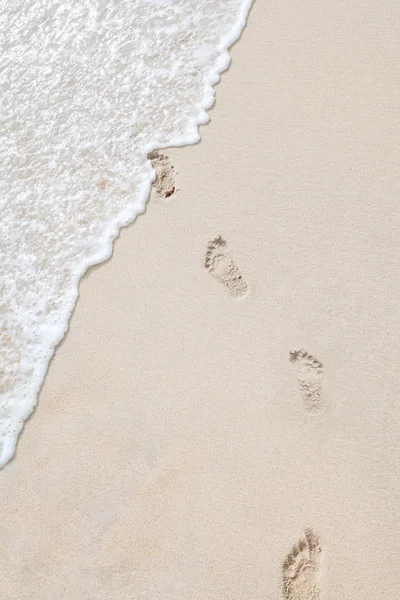 View of human steps on summer sandy beach — Stock Photo, Image