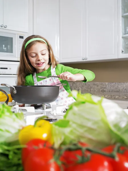 View of young beautiful girl cooking at the kitchen — Stock Photo, Image
