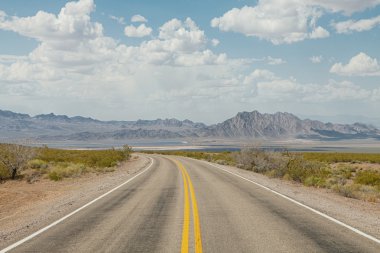 panoramic view of hot summer road through the Nevada  desertpanoramic view of hot summer road through the Nevada  desert clipart