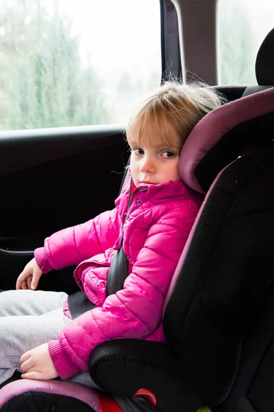 Little girl in a car seat — Stock Photo, Image