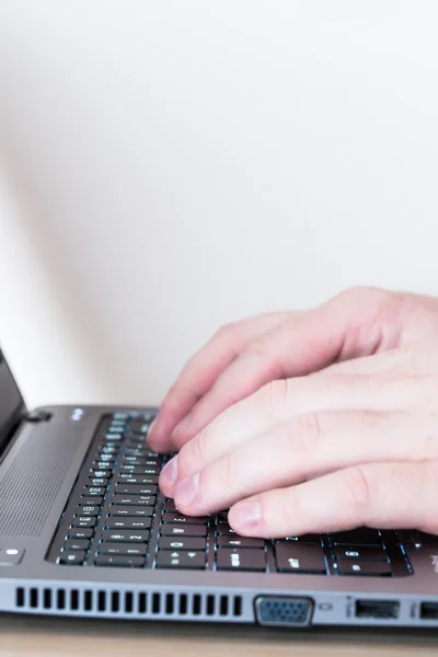 Laptop and human hands — Stock Photo, Image
