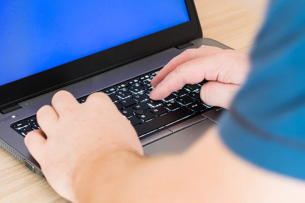 Laptop and human hands — Stock Photo, Image