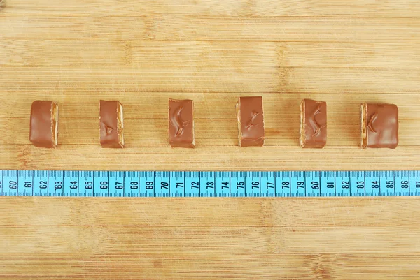 Background candy and a ruler — Stock Photo, Image