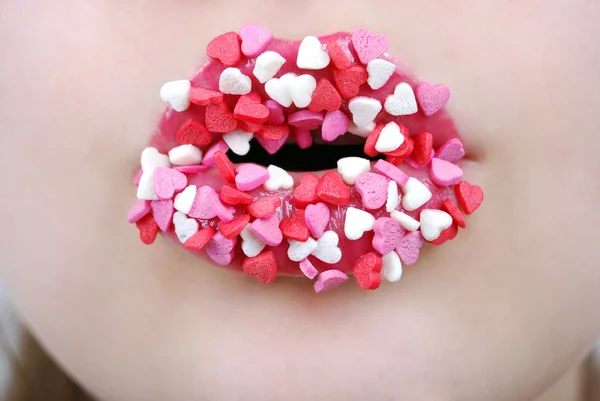 Labios femeninos con corazones pequeños Imagen De Stock