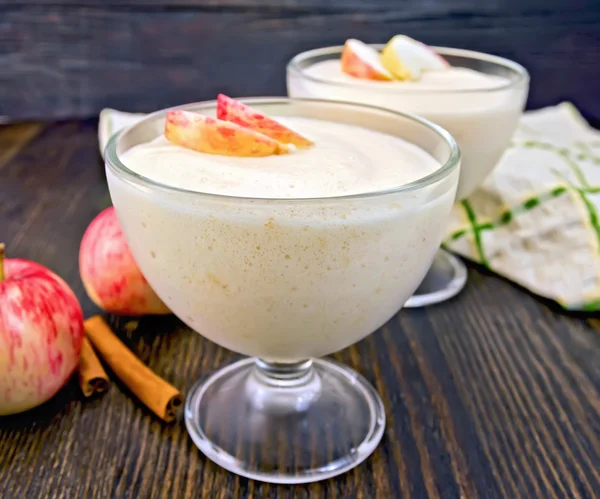 Jelly airy apple in glass bowl with cinnamon on board — Stock Photo, Image