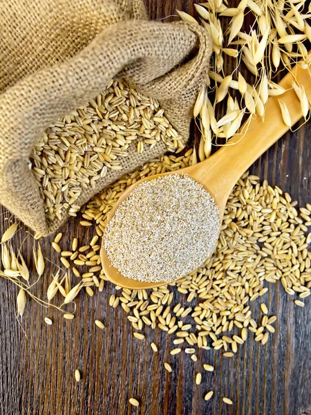 Bran flakes oat in spoon on board top — Stock Photo, Image