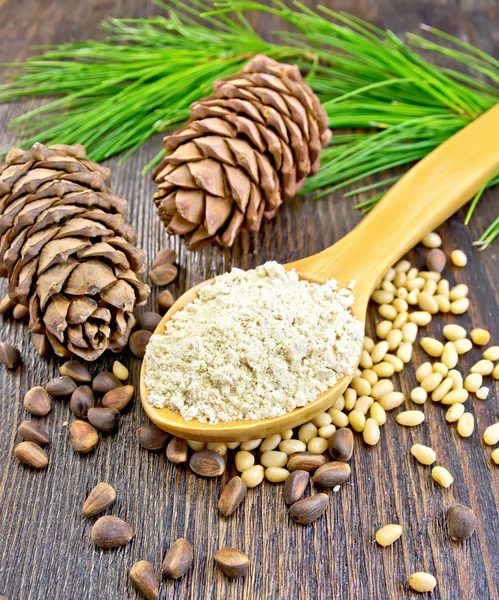 Flour cedar in spoon on board — Stock Photo, Image