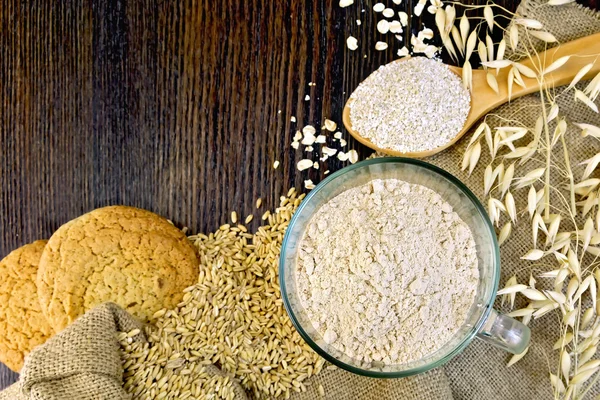 Flour and bran oat with cookies on board — Stock Photo, Image