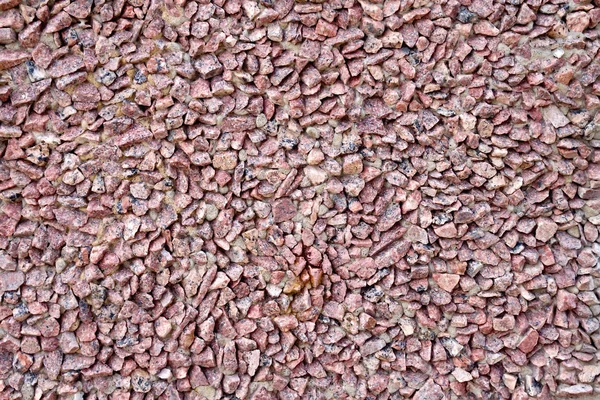 Wall of red granite gravel — Stock Photo, Image