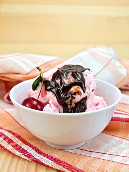 Ice cream cherry with chocolate syrup on board — Stock Photo, Image