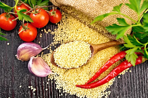 Raw Couscous Spoon Sack Burlap Tomatoes Hot Peppers Herbs Garlic — Stock Photo, Image