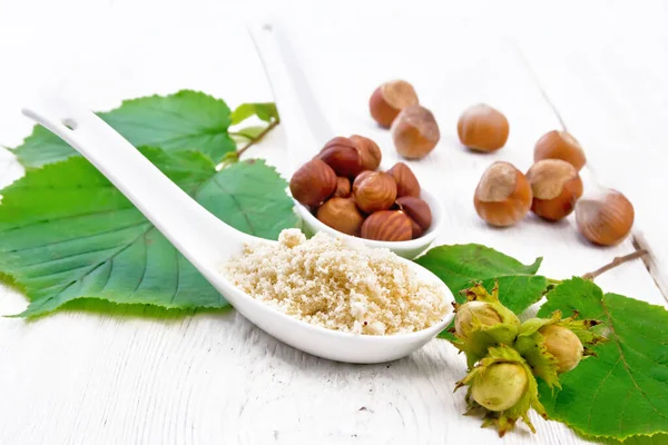 Flour Hazelnuts Two Spoons Branch Filbert Green Leaves Wooden Board — Stock Photo, Image