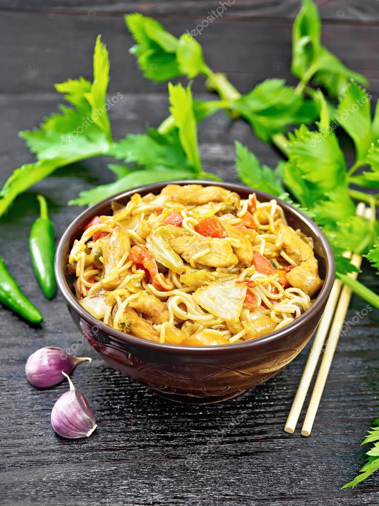 Noodles with cabbage, chicken breast, sweet red peppers, onions and