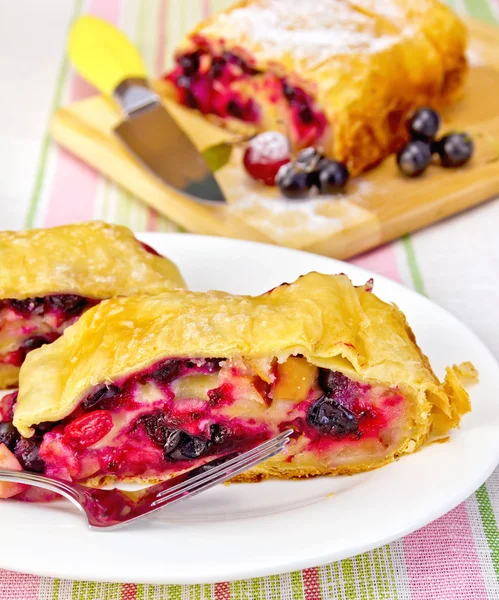 Strudel with black currants on the tablecloth — Stock Photo, Image