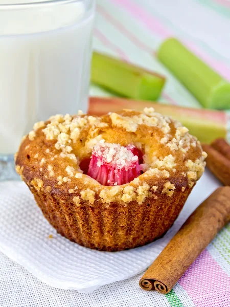 Cupcake with rhubarb and milk on napkin — Stock Photo, Image