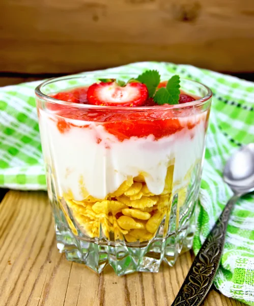 Dessert milk with strawberry and flakes in glass on board — Stock Photo, Image