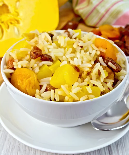 Pilaf fruit with pumpkin on board — Stock Photo, Image