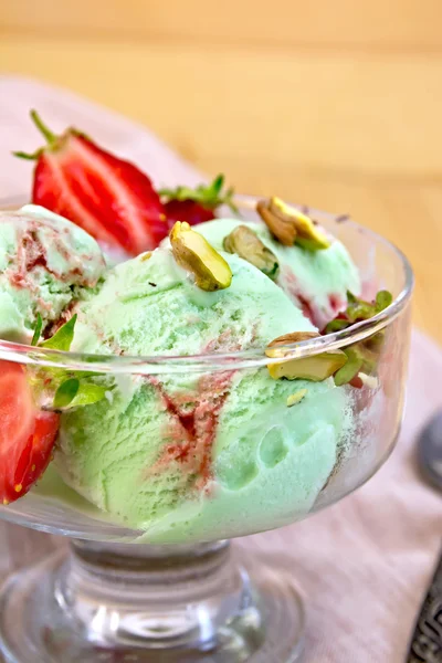 Ice cream strawberry-pistachio on napkin — Stock Photo, Image