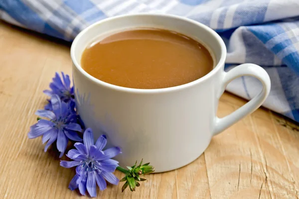 Chicory drink in white cup with flower on board — Stock Photo, Image