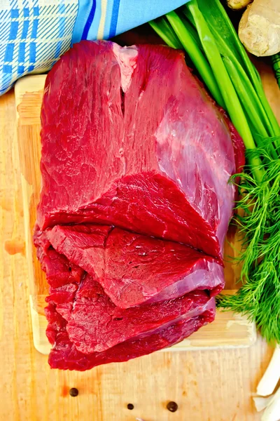 Meat beef with ginger on wooden board — Stock Photo, Image