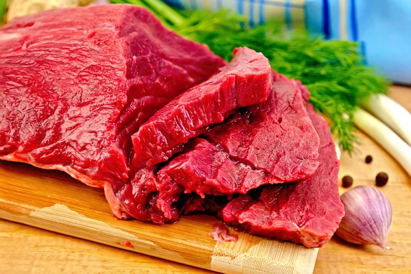 Meat beef with herbs on wooden board — Stock Photo, Image